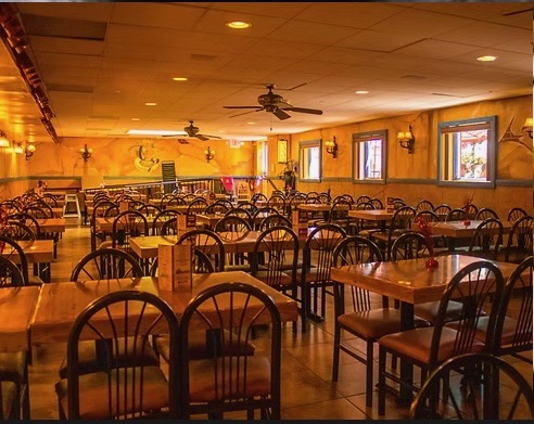 Warm, spacious dining room inside Botanas Restaurant