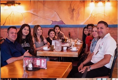 Friends and family sharing a meal at Botanas Restaurant